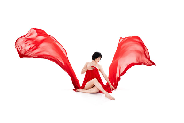 Individual posing for Nuovo’s Self-Love collection on a white backdrop
